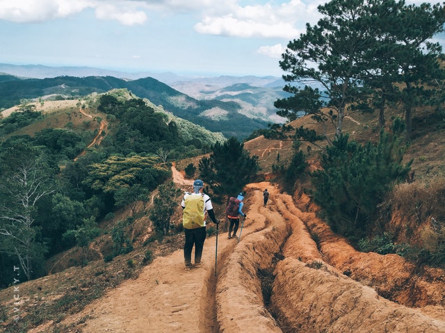 Backpacking packing advice with essential hiking gear laid out for a trail trip