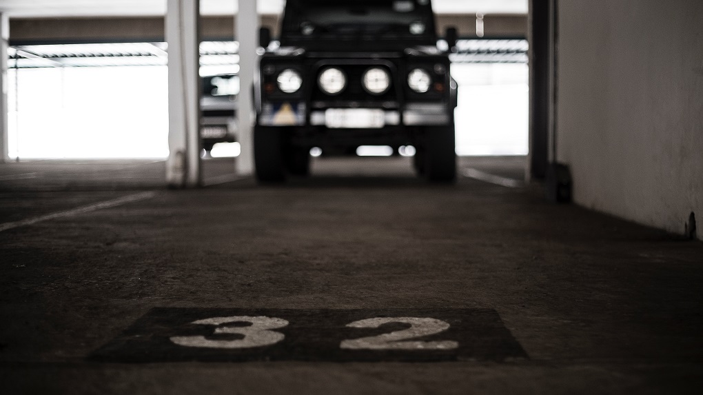 Photo of airport parking spot and luggage as a travel hack