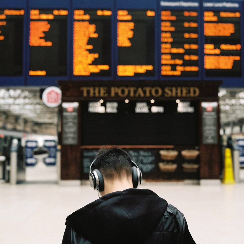 Noise-cancelling headphones at the airport gate
