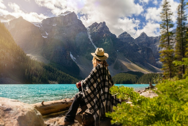 Woman camping outdoors in practical clothing
