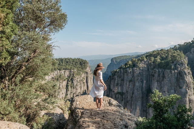 Woman wearing practical outdoor clothing for camping