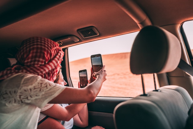 What are some cost-saving measures when taking road trips with multiple people in one vehicle?